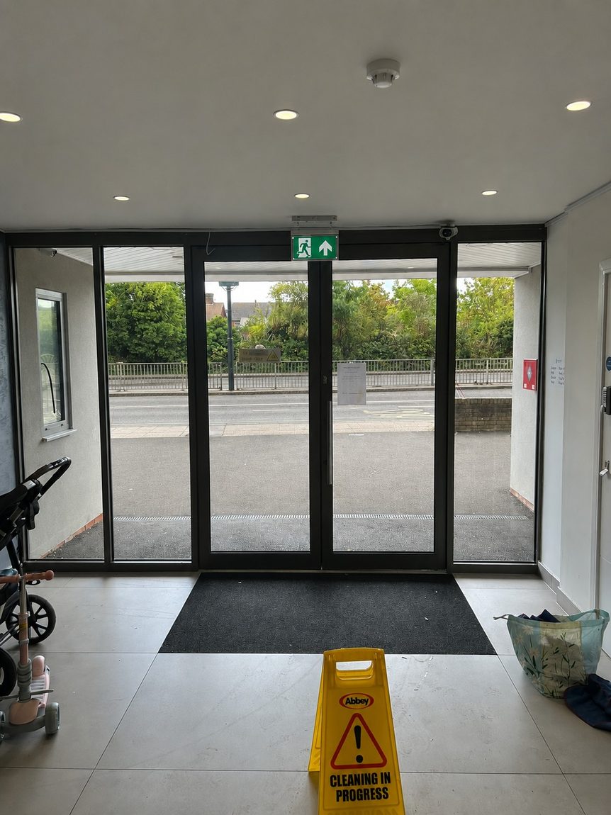 Frosted privacy window film on the communal entrance doors of a residential block of flats in West Sussex by Southpoint Window Films